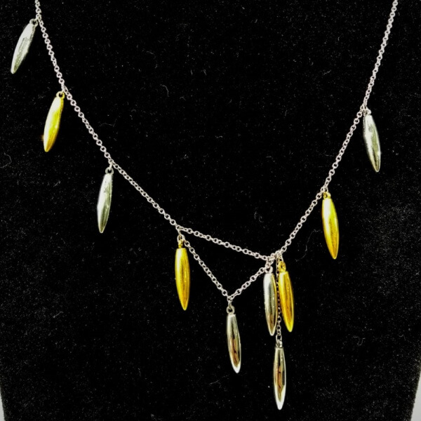 Cadena de agujas plata y dorado